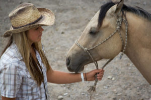 Girl holding her horse's rope