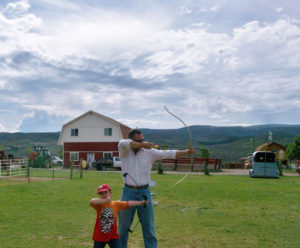 Dad and son shooting arrows