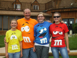Family in M & M shirts
