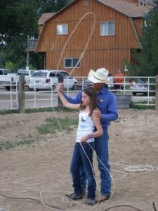 Little girl cowboy roping
