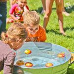 Kids bobbing for apples