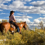 Woman enjoying nature on her horse