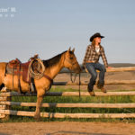 Woman sitting by her horse