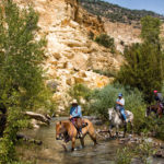 Horseback ridding through water
